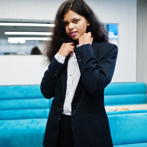 Gorgeous indian woman wear formal posing at cafe.